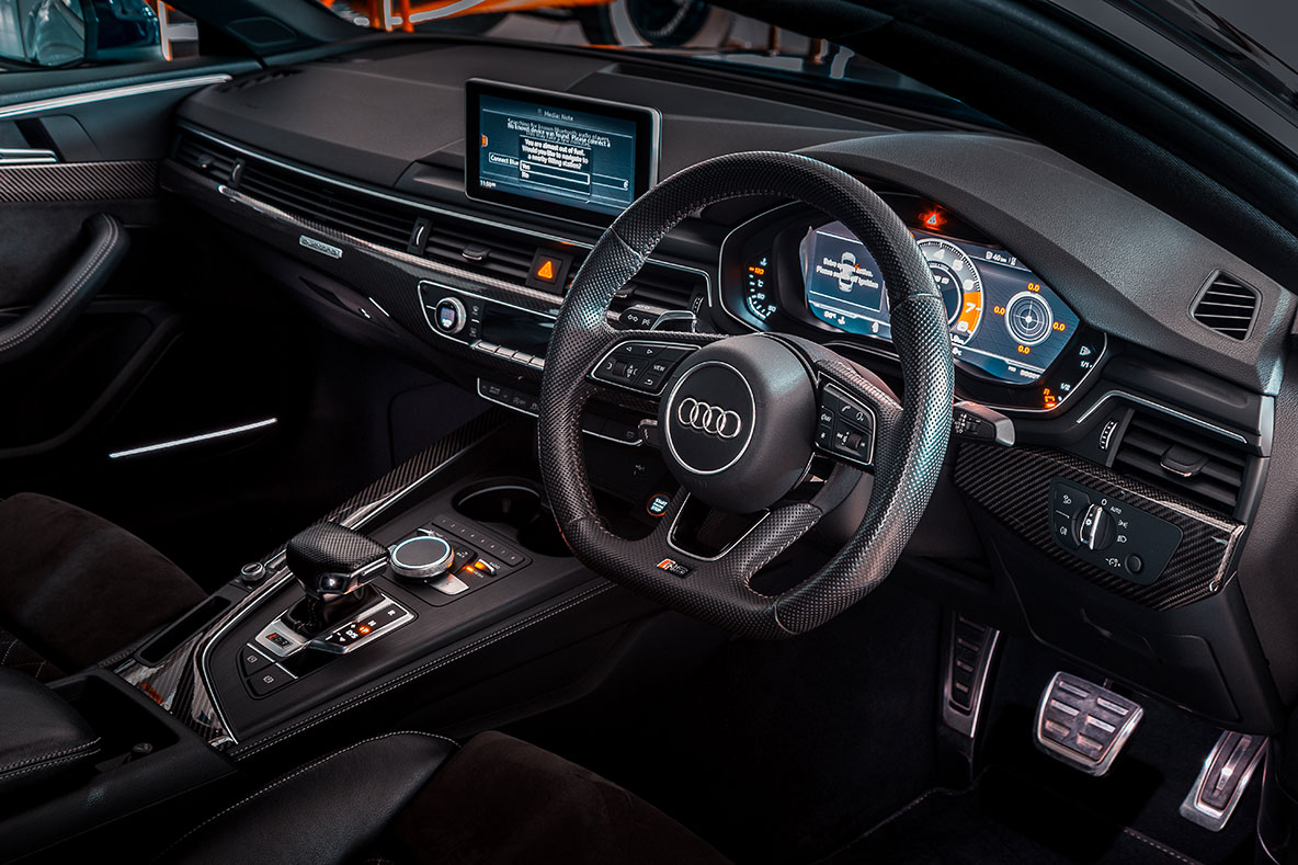 dashboard and steering wheel of a fancy new Audi